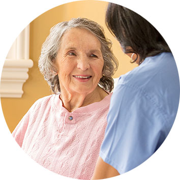 home care franchise caregiver talking with senior